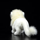 Rear view of a white lion plush toy displaying its soft tail and realistic design