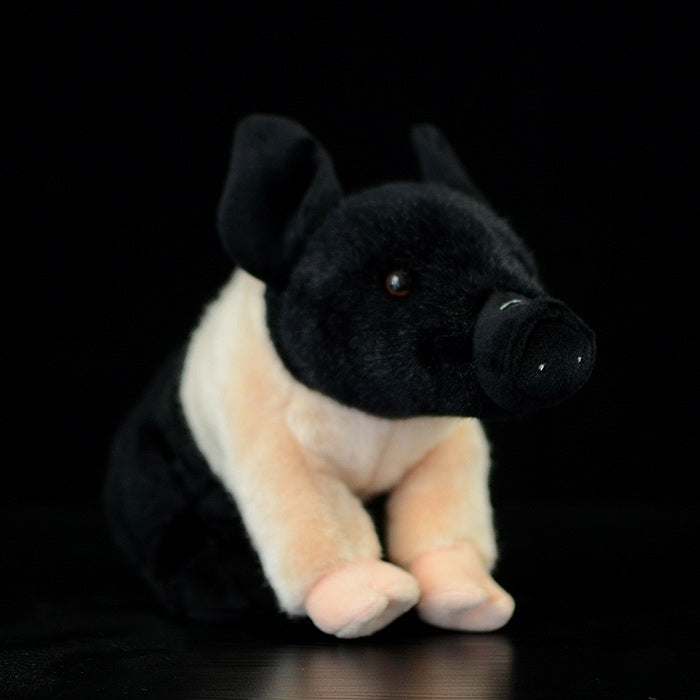 Side view of black and white mini teacup pig plush toy with lifelike design by SoftDaysLab