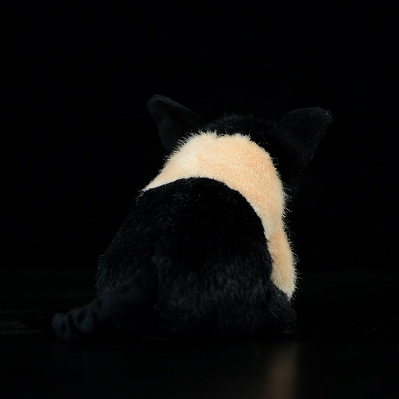 Back view of black and white pig plush toy with a curled tail and soft fur texture by SoftDaysLab