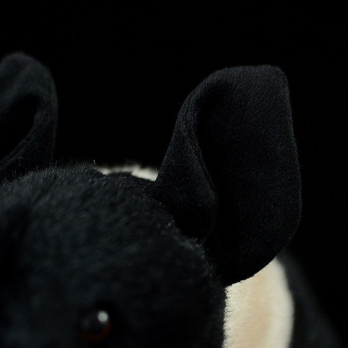 Close-up of black and white pig plush’s ear, showing lifelike texture and detail by SoftDaysLab