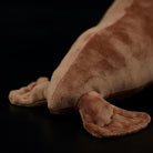 Close-up of the fur seal plush toy's flippers, highlighting its soft and durable material