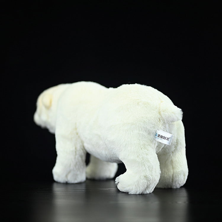Back view of a polar bear plush toy highlighting its fluffy tail and soft, realistic texture