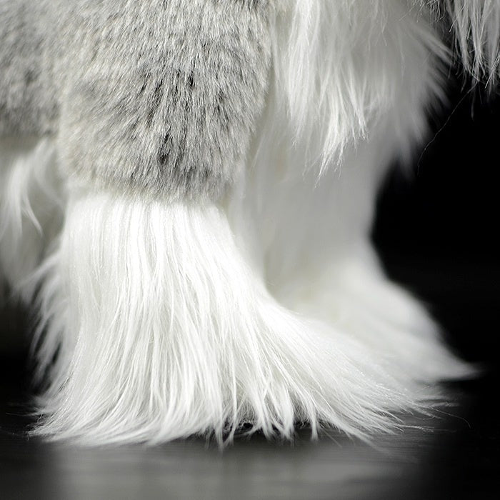 Close-up of the detailed furry legs of a Salt and Pepper Miniature Schnauzer plush toy by SoftDaysLab