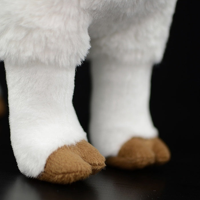 Close-up of the goat plush toy's hooves, designed with realistic brown detailing and soft texture