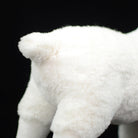 Fluffy tail of the white goat plush toy, featuring soft and cuddly material