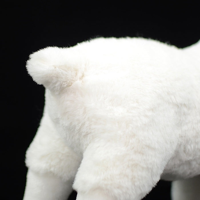Fluffy tail of the white goat plush toy, featuring soft and cuddly material