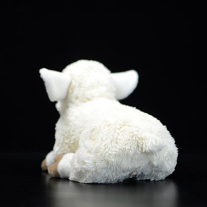 Back view of the fluffy sheep plush, highlighting its soft and realistic design