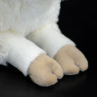 Close-up of the sheep plush's hooves, showing its lifelike and adorable design
