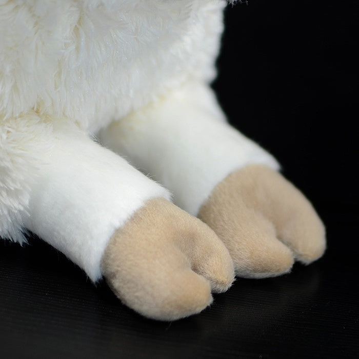 Close-up of the sheep plush's hooves, showing its lifelike and adorable design