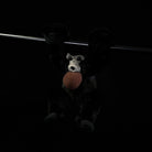 Lifelike Siamang Gibbon plush hanging pose, featuring soft black fur and expressive design