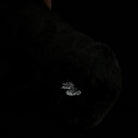 Detailed shot of Siamang Gibbon plush hand, showing intricate stitching and soft premium material