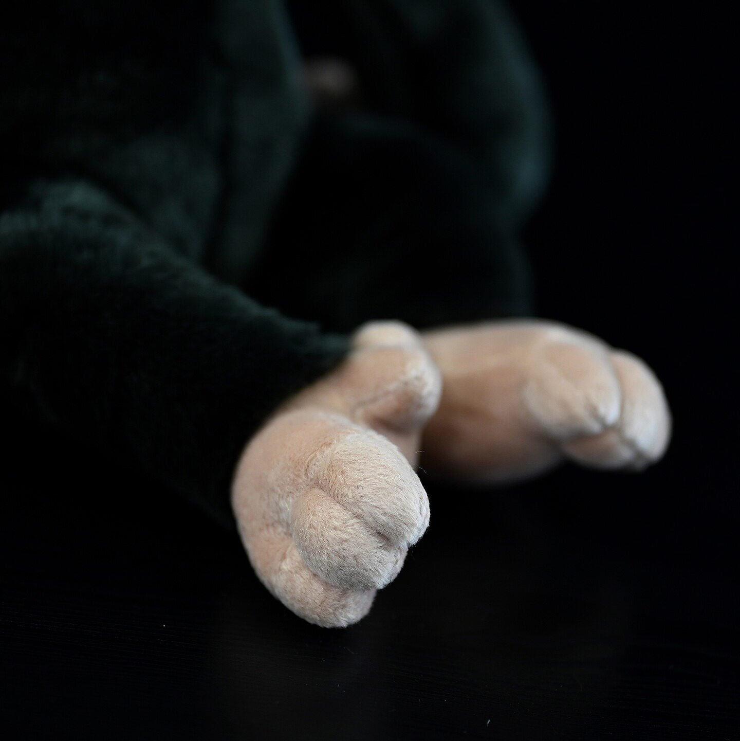 Close-up of chimpanzee plush feet, designed for realism and softness, a perfect wildlife-themed gift