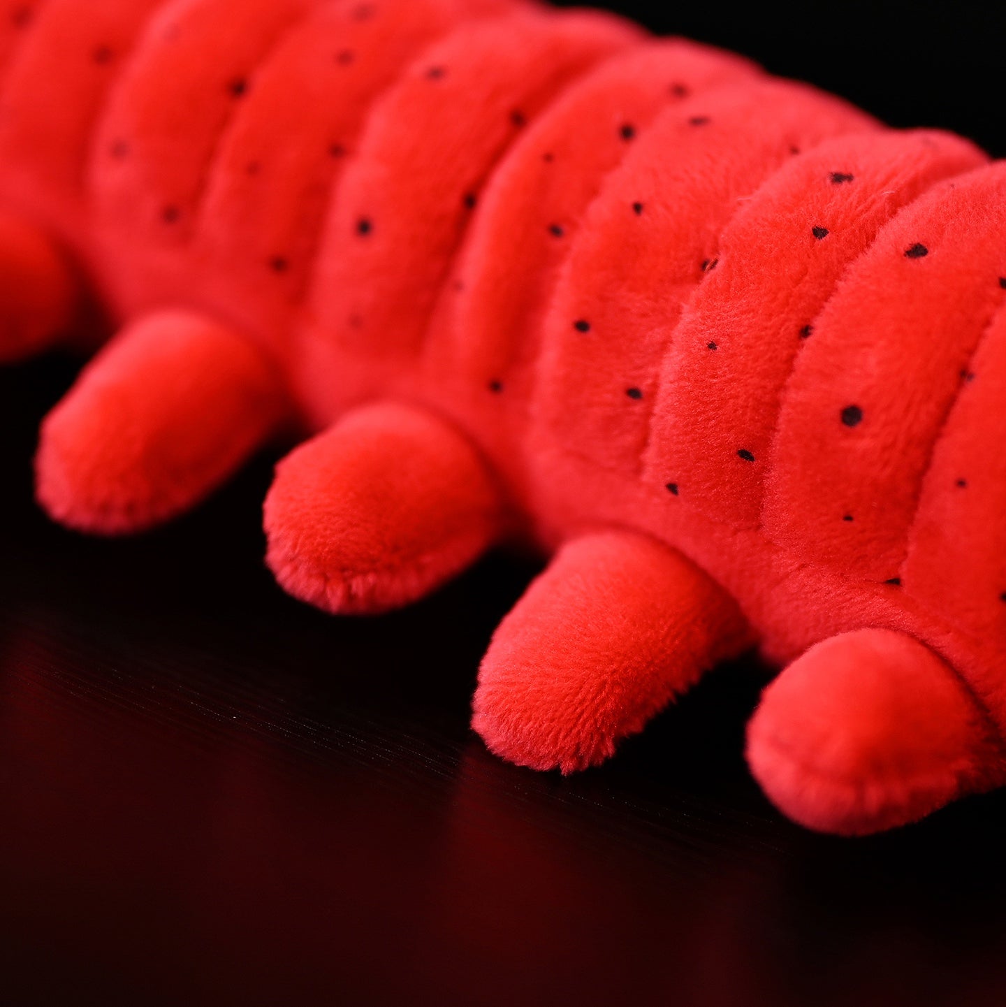 Detailed view of the velvet worm plush toy's soft segmented body and legs by SoftDaysLab