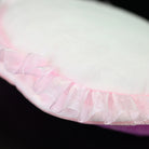 Close-up of the Kimberella plush toy's underside, highlighting its soft fabric and delicate pink frill design by SoftDaysLab
