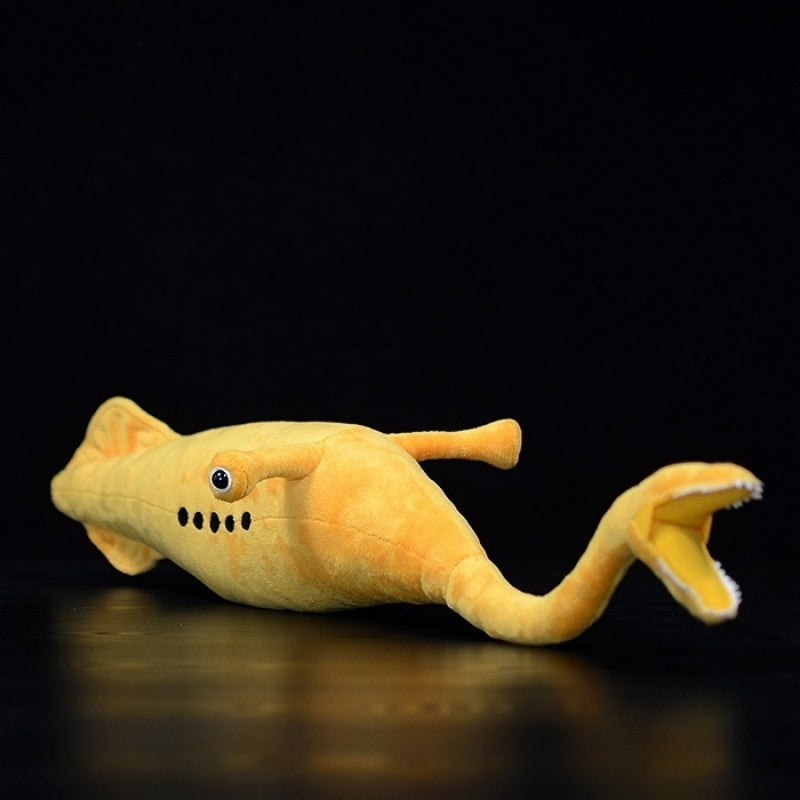 Side view of Tully Monster plush toy, featuring its elongated body and unique prehistoric design by SoftDaysLab