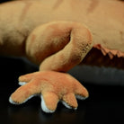 Close-up view of bearded dragon plush toy's clawed foot, showing soft fabric details by SoftDaysLab