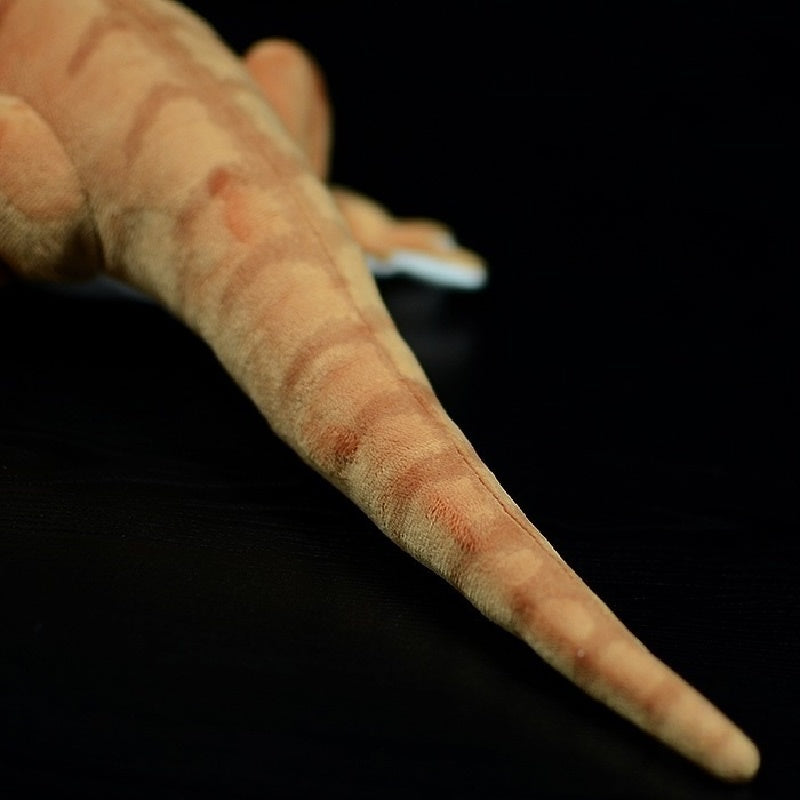 Tail close-up of realistic bearded dragon plush toy showcasing striped texture and a natural curve by SoftDaysLab