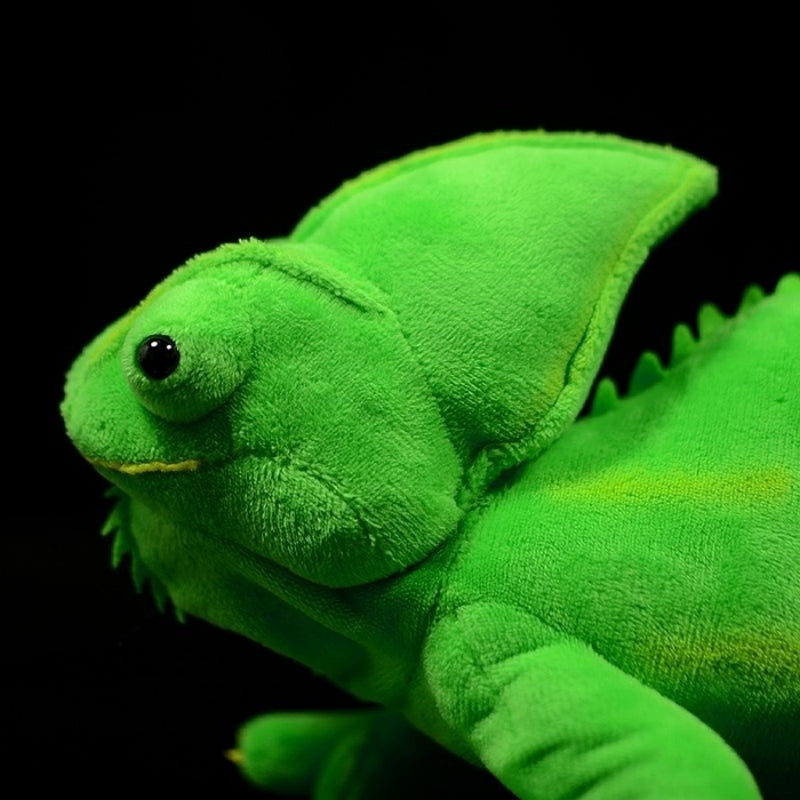 Detailed side face of green chameleon plush toy with textured head and lifelike features for decor or play