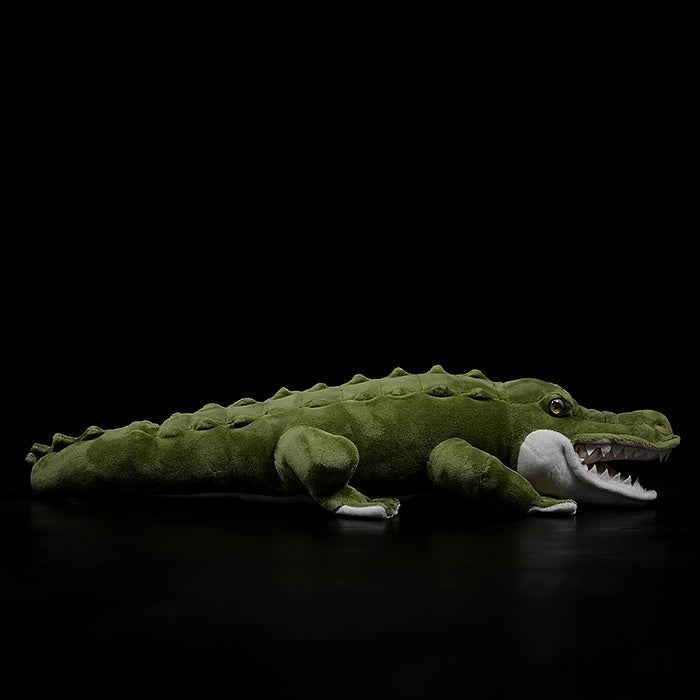 Side view of a lifelike alligator plush toy with detailed scales and a realistic design