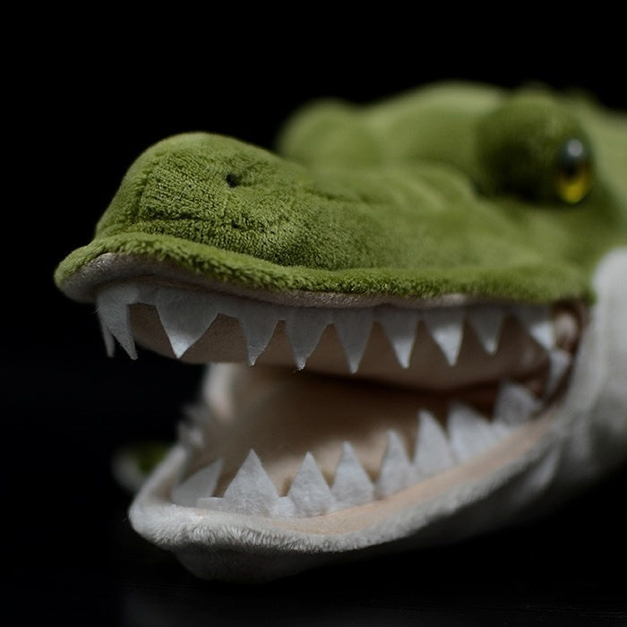Close-up of the alligator plush’s open jaws, revealing sharp teeth and realistic features