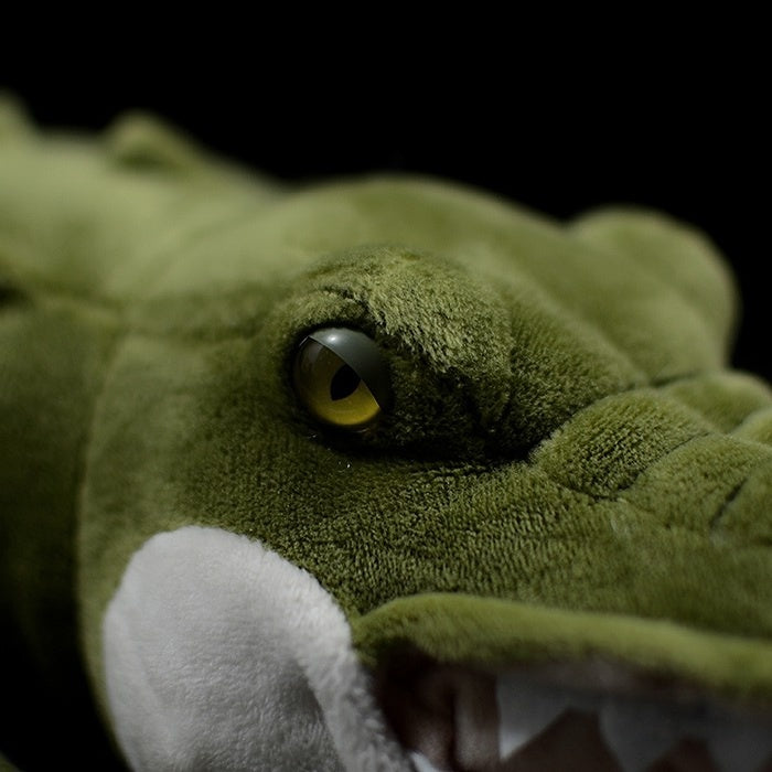 Close-up of the alligator plush's eye, showcasing its lifelike design and detailed craftsmanship