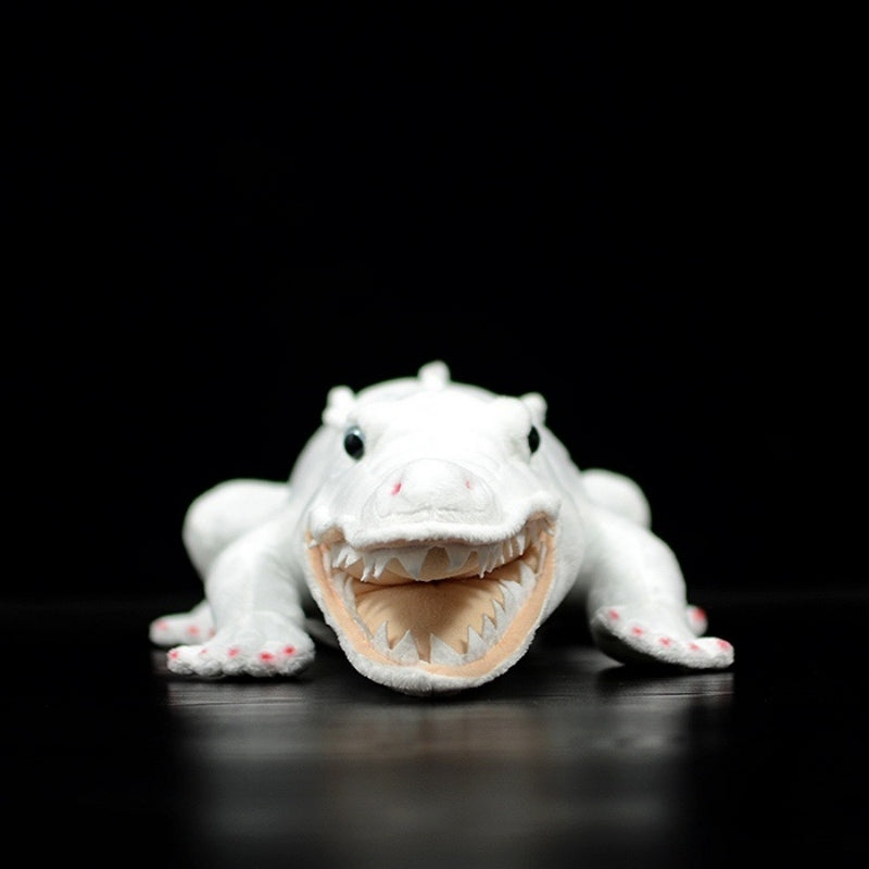 Front view of albino alligator plush toy showing lifelike teeth and white body fabric