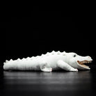 Side view of albino alligator stuffed animal with spiked tail and lifelike reptile design by SoftDaysLab