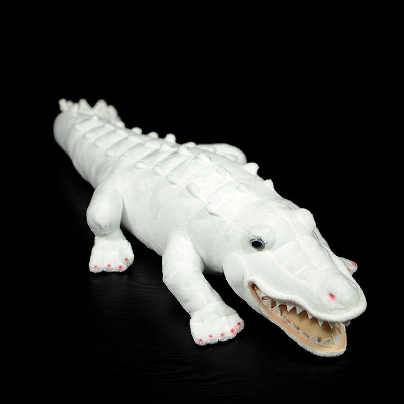 Top view of albino alligator plush toy, featuring realistic soft details and textured body
