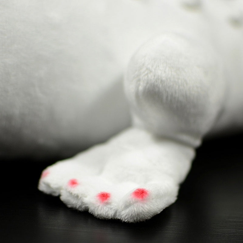 Focused view of albino alligator plush's detailed paws with pink accents for added realism