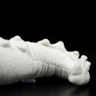 Tail close-up of albino alligator toy showcasing soft curves, spikes, and detailed texture by SoftDaysLab