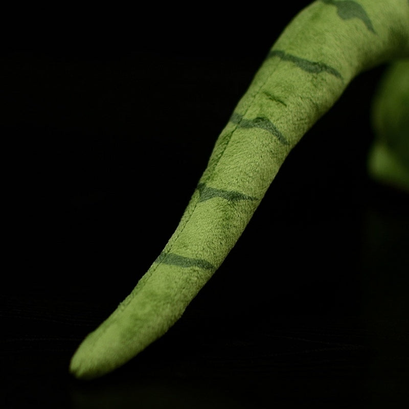 Zoomed-in view of T-Rex dinosaur plush toy’s striped tail, crafted with detailed stitching for lifelike appeal