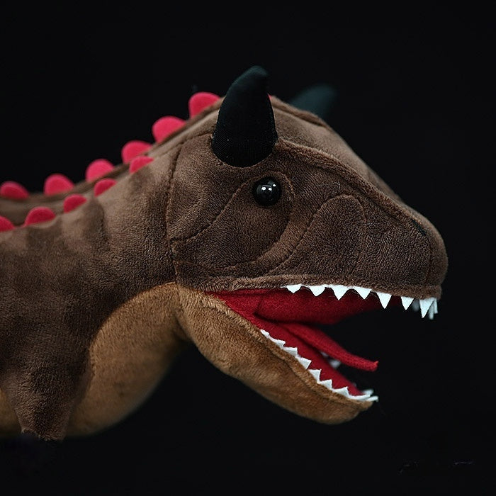 Close-up of Carnotaurus Dinosaur Plush Toy's head with sharp teeth and textured horns