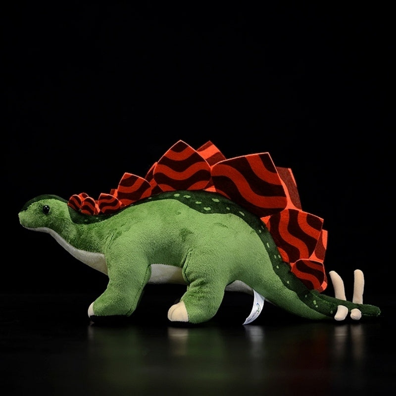Side view of Stegosaurus stuffed animal showing red back plates and realistic dinosaur design