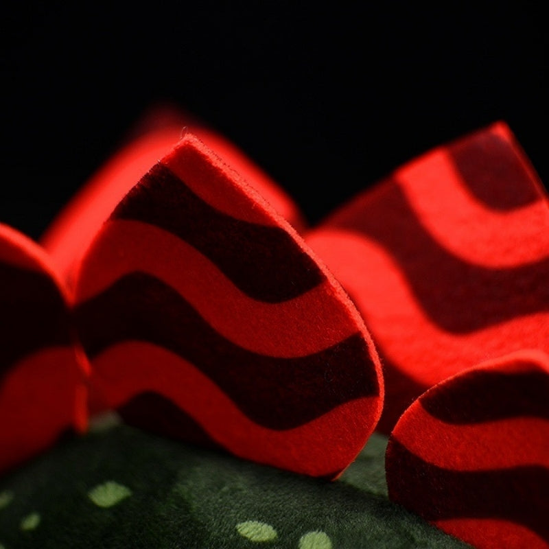 Red patterned back plates on Stegosaurus stuffed animal designed with intricate details like the real dinosaur