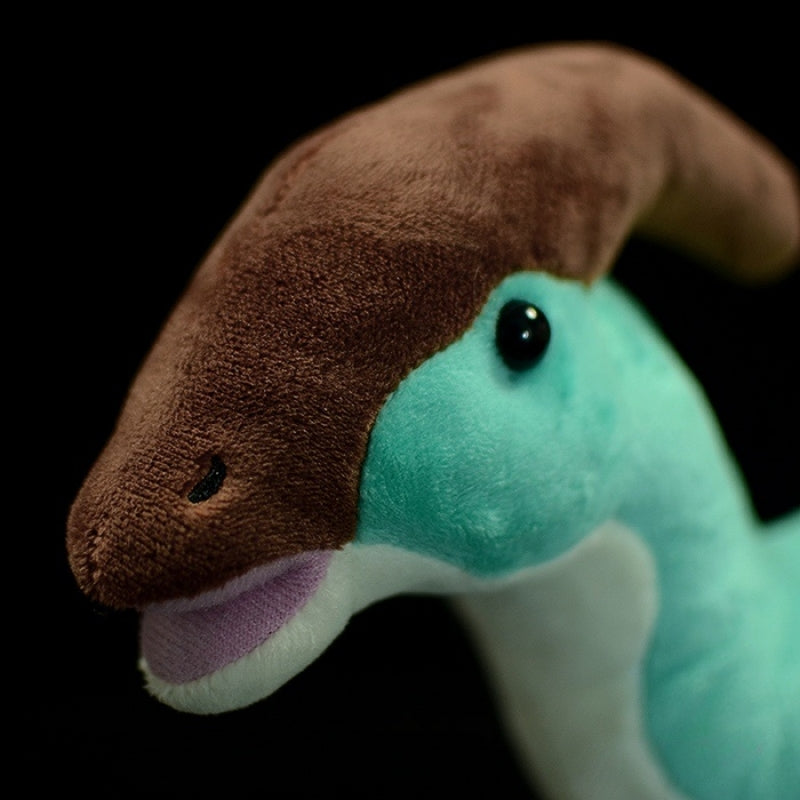 Close-up of Parasaurolophus dinosaur plush toy featuring its cute face and soft-textured crest