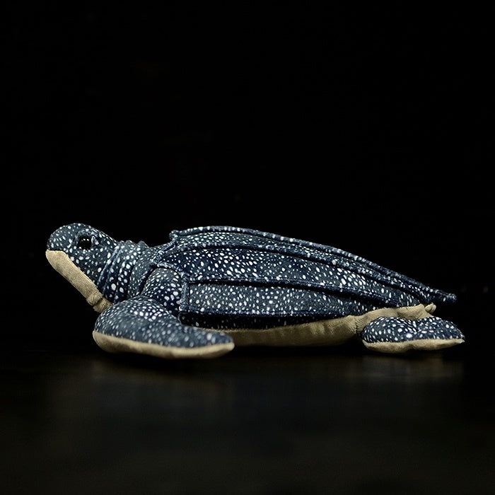 Side view of a leatherback sea turtle plush, showcasing its detailed flippers and realistic design