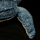Close-up of the leatherback sea turtle plush's flipper, showcasing soft textures and realistic design