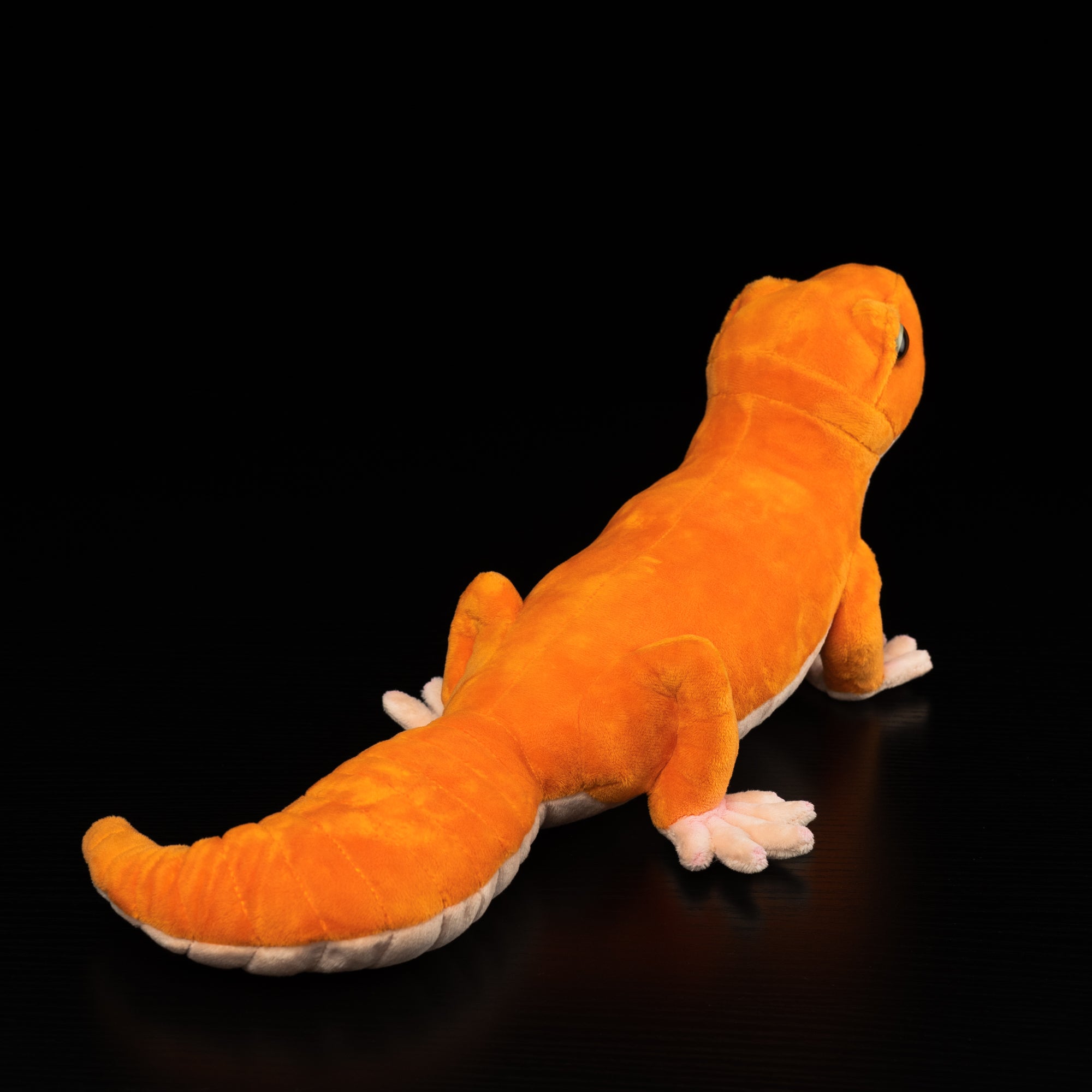 Rear view of the Amel Patternless African Fat-Tailed Gecko Plush, featuring its detailed tail and adorable finish