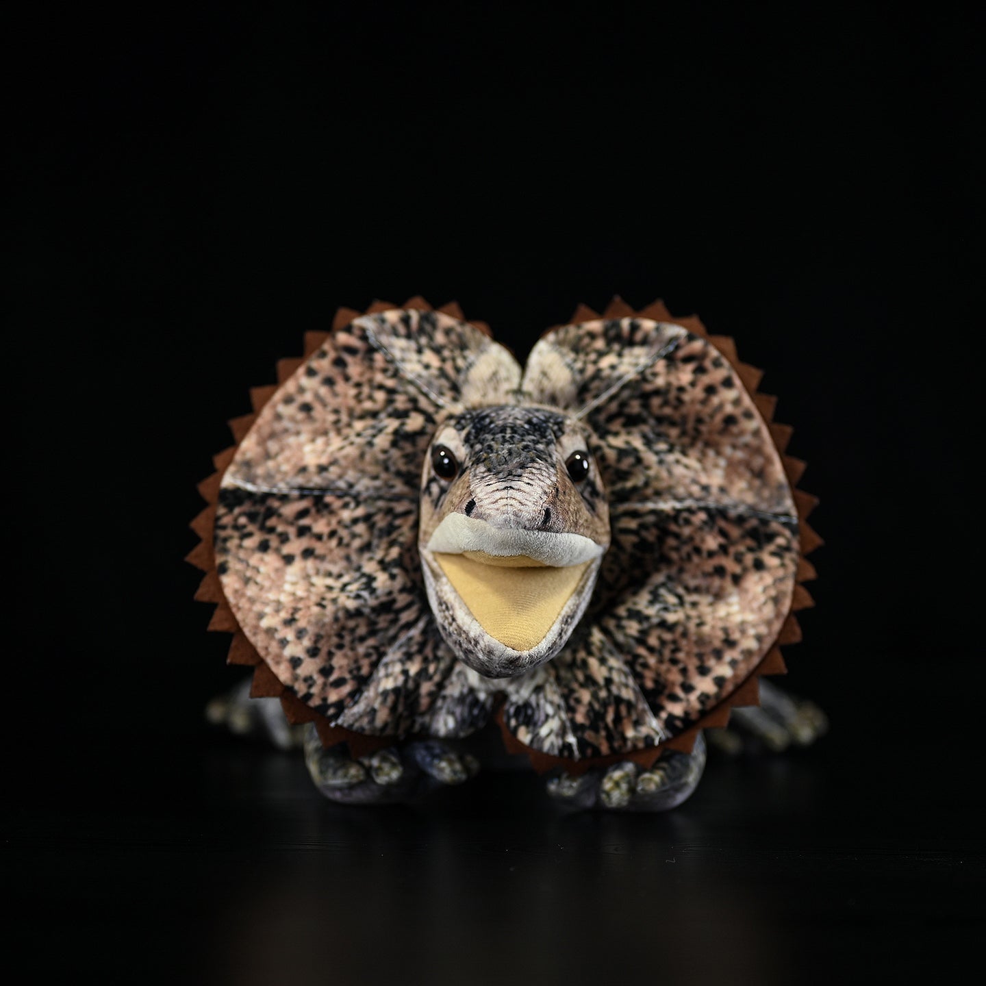 Front view of a frilled lizard plush with its vibrant frill fully displayed, capturing its iconic design