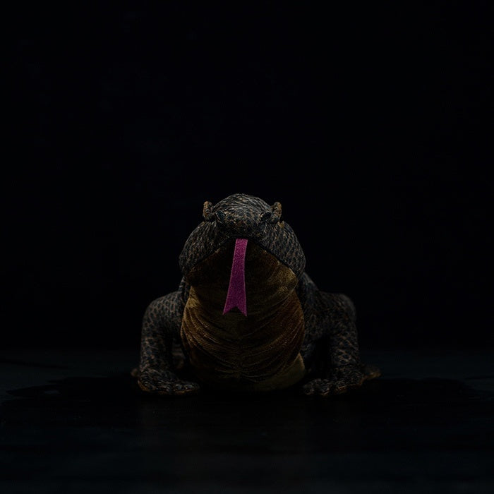Front view of a Komodo dragon plush toy showcasing its lifelike tongue and intricate details
