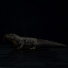 Side profile of a Komodo dragon plush toy with a realistic scaly texture and lifelike appearance