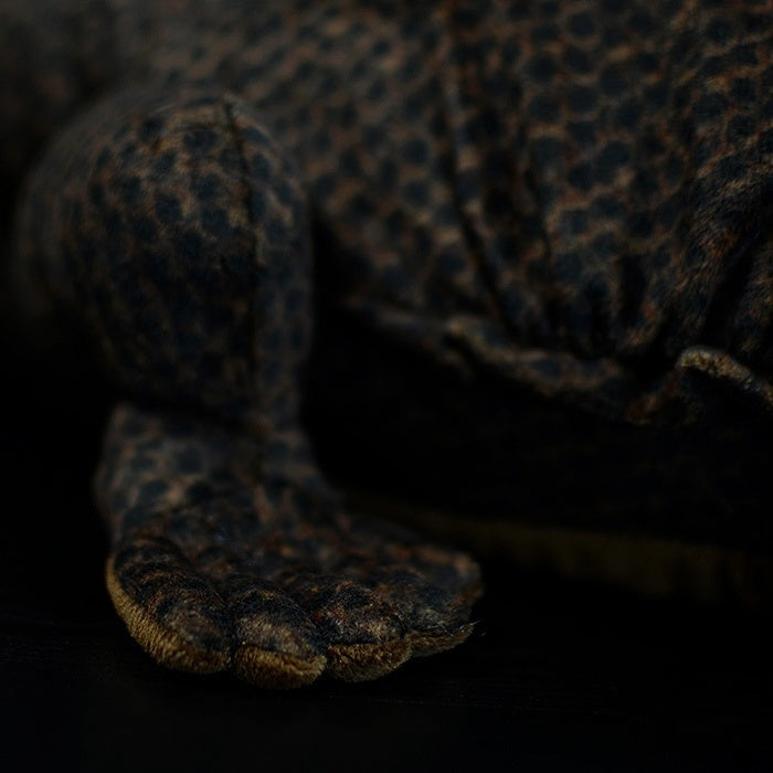 Detailed view of the Komodo dragon plush toy’s clawed foot with realistic textures