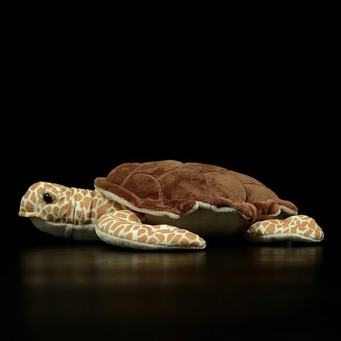 Side profile of a soft and realistic Hawksbill sea turtle stuffed animal with intricate shell details