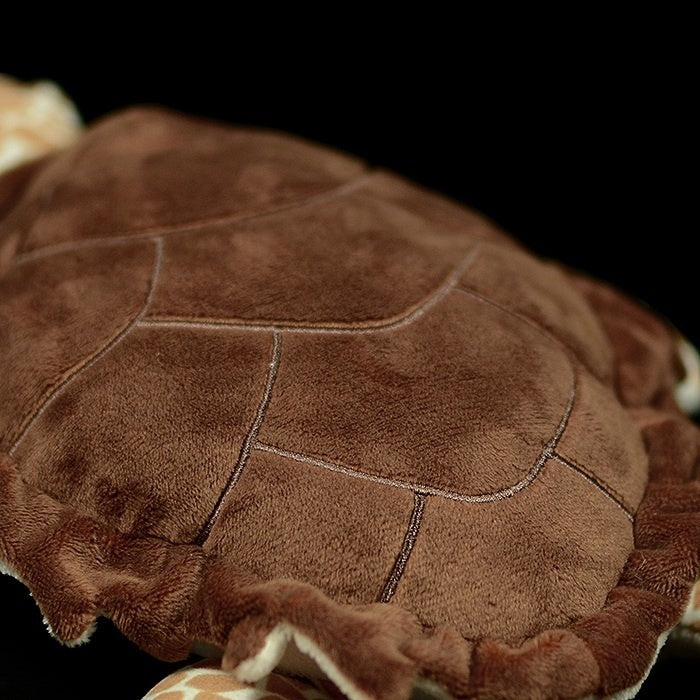 Close-up of the shell of a Hawksbill sea turtle plush toy, featuring realistic texture and stitching