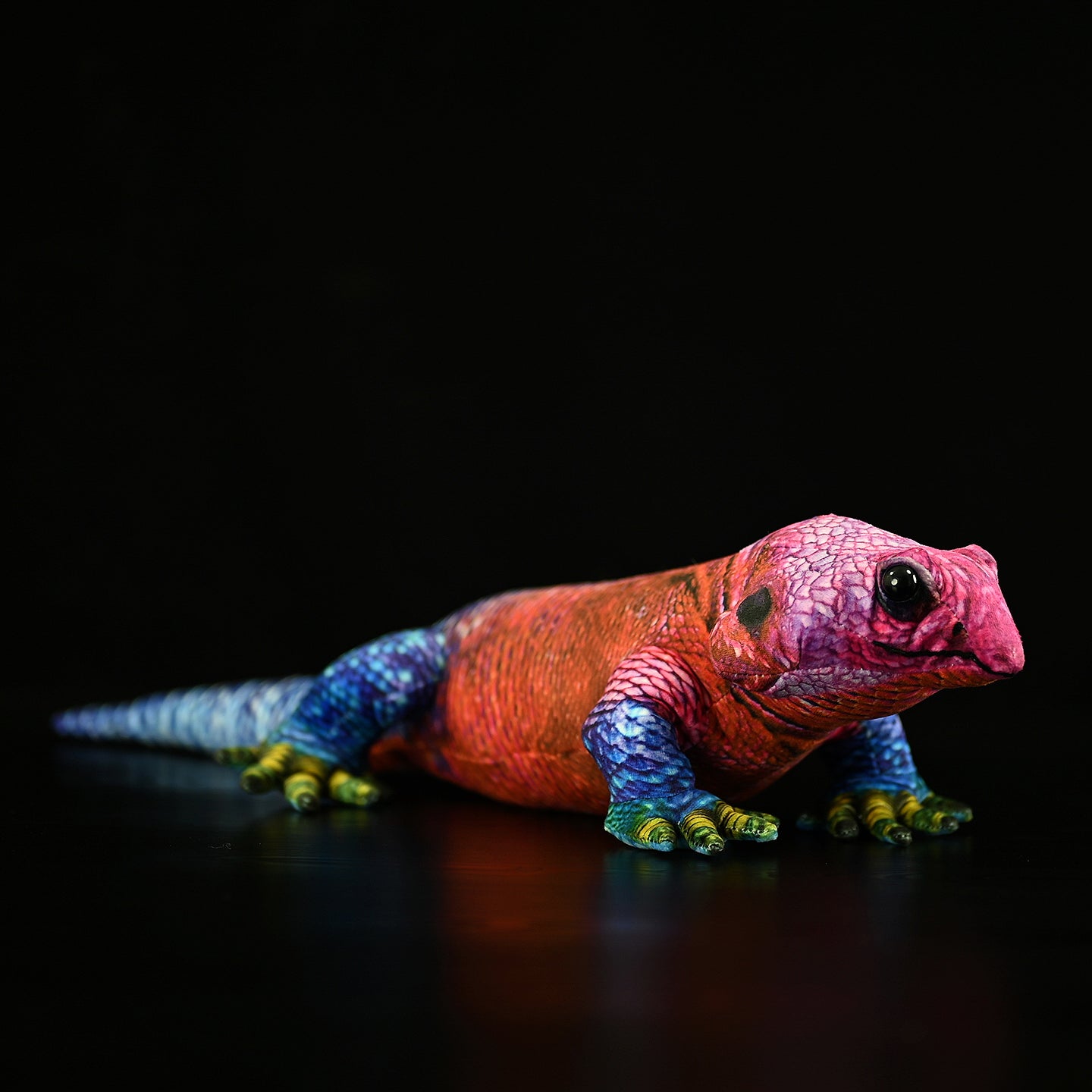 Spider-Man Agama plush in a resting pose, highlighting its vibrant, accurate lizard-inspired coloration