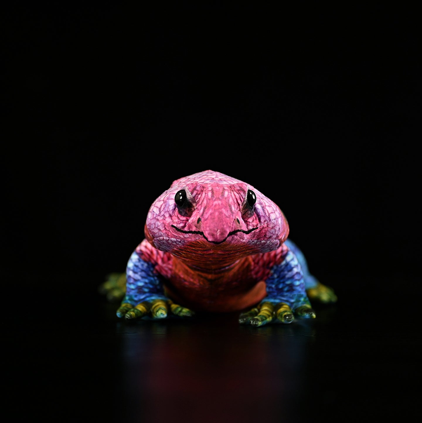 Front view of a Spider-Man Agama plush with bright red head and blue body, inspired by the real lizard