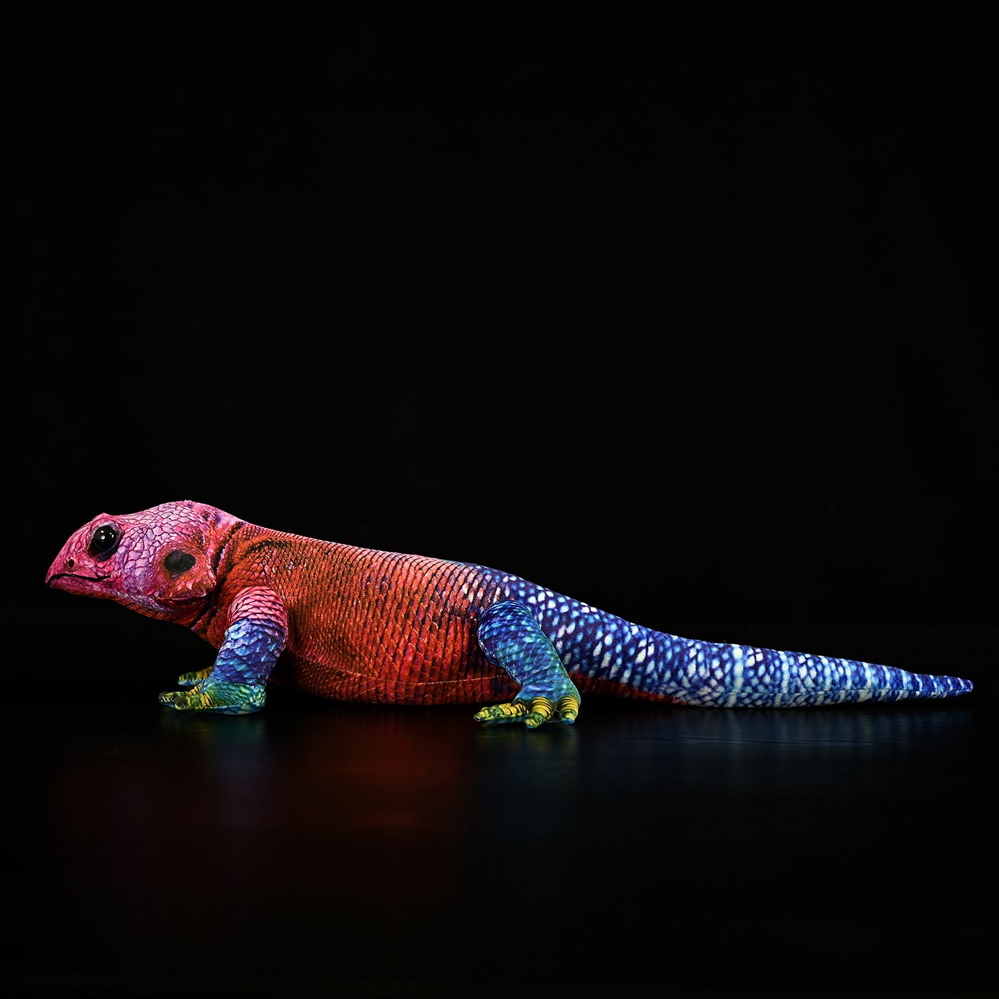 Realistic printed Spider-Man Agama plush toy capturing its striking red, blue, and green coloration in detail