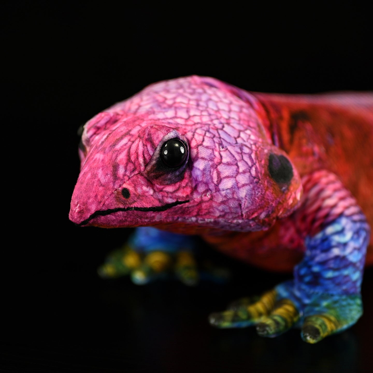 Detailed headshot of the Spider-Man Agama plush with lifelike red tones and vivid eye details for realism