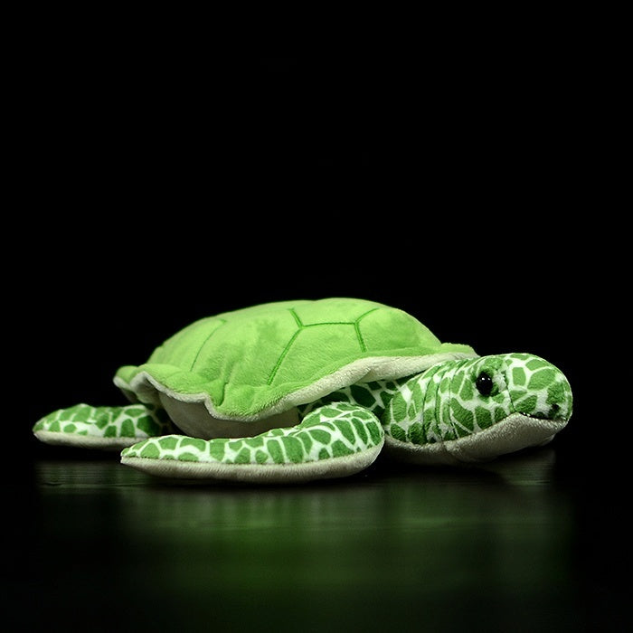 Lifelike green sea turtle plush showing its soft green shell and realistic details