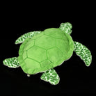 Side profile of the green sea turtle plush, featuring a soft shell and patterned flippers
